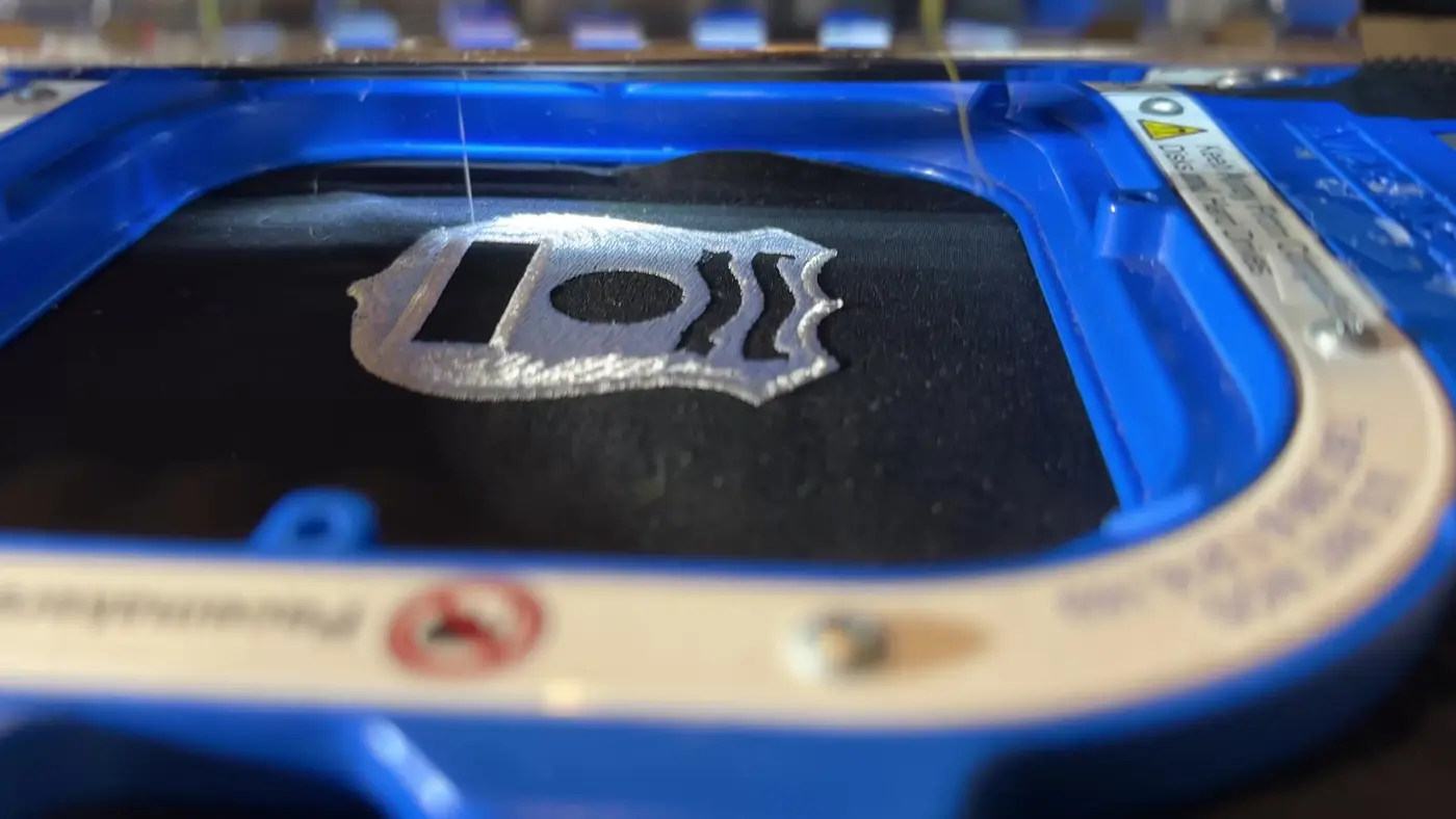 A department emblem being stitched on our embroidery machine